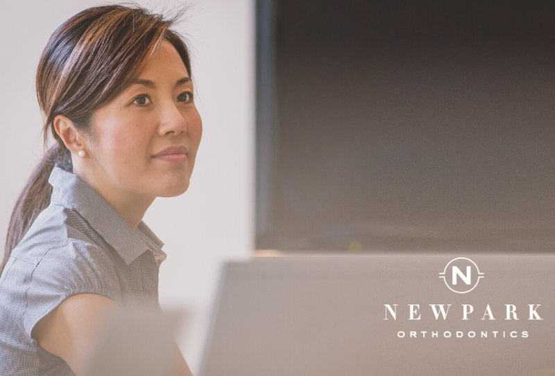 woman with adult orthodontics at work