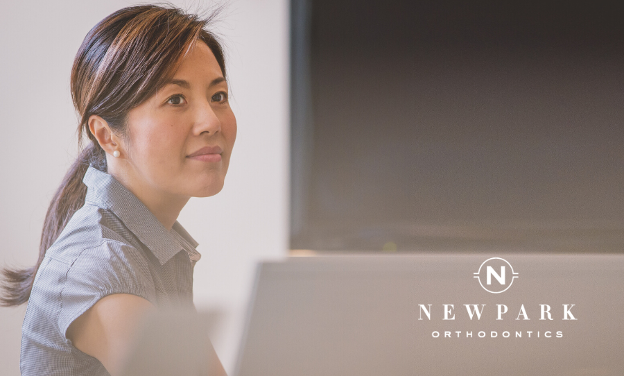 woman with adult orthodontics at work