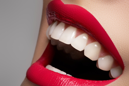 close up of woman with lipstick laughing