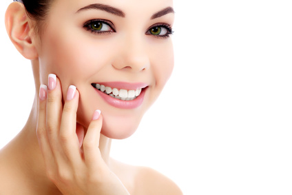 woman holding her face smiling